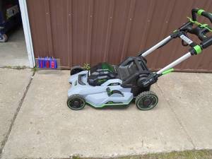 E-Go 56 volt cordless self propelled lawn mower. No battery or charger. Used condition. As shown.