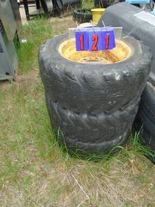 Qty of 3 skid steer tires & wheels off New Holland L325. 2 are filled. As shown.