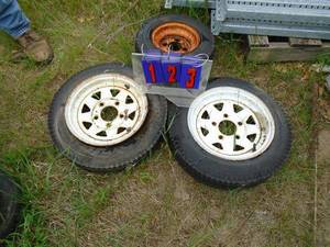 Qty of 2 12 trailer tires & 1 8 well used. As shown.