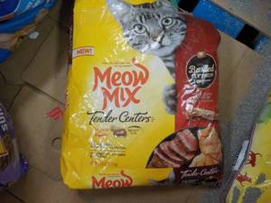 lot 12 image: Meow Mix Cat Food- damaged bag...