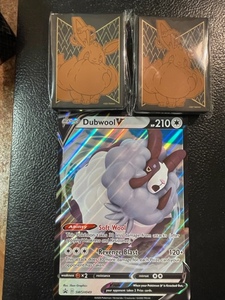 lot 56 image: Pokemon Dubwool Oversize Card and 2 Packs of Card Sleeves