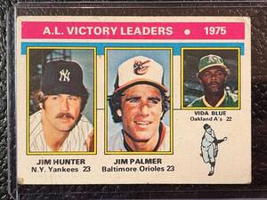 lot 157 image: 1976 Topps Jim Hunter Jim Palmer Vida Blue Leaders Card #200