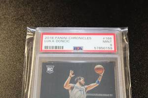 lot 7 image: 2018-19 Panini Chronicles Luminance Luka Doncic #166 PSA 9