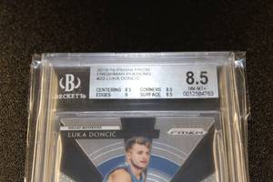 lot 100 image: 2018-19 Prizm Freshman Phenoms Luka Doncic #23 BGS 8.5