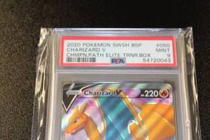 lot 107 image: 2020 Pokemon Champions Patch Black Star Promo Charizard #SWSH050 PSA 9