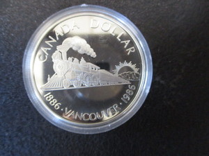 lot 1-12 image: 1886-1986 Vancouver Centennial Canadian Silver Dollar in Protective Removable Capsule