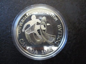 lot 1-16 image: 1983 Edmonton Canadian Silver Dollar in Protective Removable Capsule