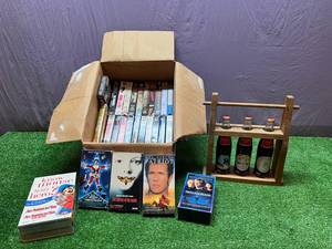 lot 179 image: Coca-Cola ND Centennial Bottles & VHS Tapes