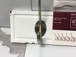 lot 31 image: Lot of Assorted 27 in. White Rack with 5 Satin Nickel Hooks by Home Decorators Collection Customer Returns See Pictures