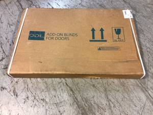 lot 85 image: White Cordless Add On Enclosed Aluminum Blinds with 12 in. Slats, for 22 in. Wide x 36 in. Length Door Windows by ODL Customer Returns See Pictures