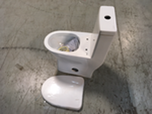 lot 101 image: Sublime II 1-Piece 0.81.28 GPF Dual Flush Elongated Toilet in White by Swiss Madison Customer Returns See Pictures