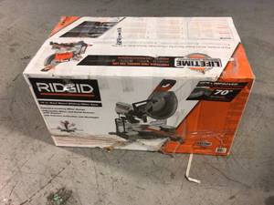 lot 107 image: 15 Amp Corded 12 in. Dual Bevel Sliding Miter Saw with 70 Deg. Miter Capacity and LED Cut Line Indicator by RIDGID Customer Returns See Pictures