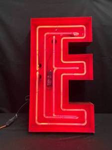 lot 84 image: Red E Channel letter with Ruby Red neon glass