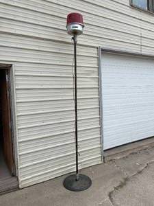 lot 126 image: Pole mounted, Tripp Lite, Rotating red emergency light on Pennzoil base