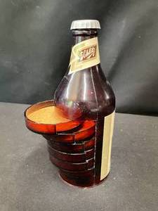 lot 212 image: Schlitz paper tablecloth and cool bottle with coasters
