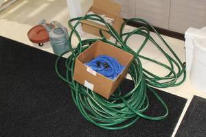 lot 32 image: Gardening Supplies, Hoses, Gloves, Watering Can, Planter Dolly