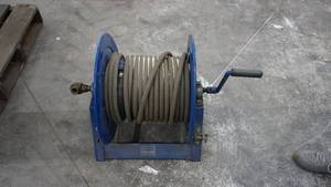 lot 23 image: High Pressure Hose Reel With A Pressure Washer Hose On It