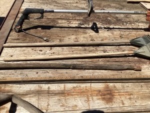 lot 68 image: Electric trimmer, 2 shrub rakes, hand sy, arrow tank dipping stick & vintage railroad tool