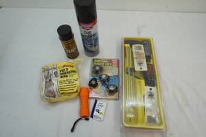 lot 60 image: Outers gun cleaning kit, trigger locks, flashlight, field dressing bag, gun scruer, Break-Free lubricant, ear plugs
