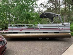 lot 1 image: Weeres Suntanner 1996 24 foot Pontoon Boat with 70 hp Evinrude Motor with Tilt and Trim, and Trinity Trailer - many extras all ready for your summer enjoyment