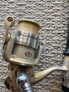 lot 78 image: Shimano graphite fishing rod and Pflueger reel.