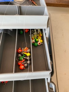 lot 82 image: GRAY PLANO TACKLE BOX WITH TACKLE