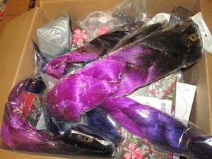 lot 8 image: box of hair extensions, nail polish...
