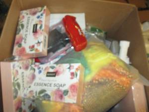 lot 42 image: box of essence soap , blanket, sh...