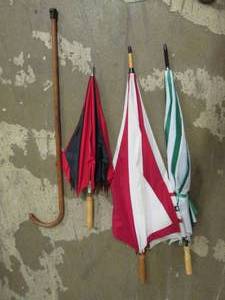 lot 110 image: 3 umbrellas and a cane ...