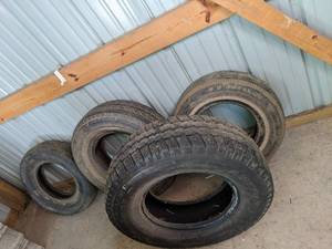 lot 185 image: 4 misc tires, see photos for sizes....