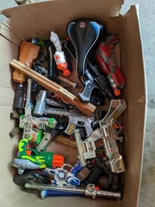 lot 268 image: Schwinn bike seat, toy guns and mor...