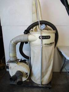 lot 8 image: Shop Fox Dust Collector on wheels. Model 2HP 110220V