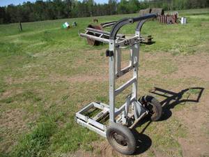 lot 65 image: Metal Stationary Horseback Riding Saddle RackStand on wheels. One Rack.