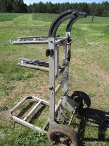 lot 66 image: Metal Stationary Horseback Riding Saddle RacksStand on wheels. Two Racks.