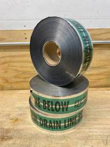 lot 38 image: Lot of 3 Rolls of Caution Tape (Caution Storm Drain Line Below)