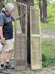 lot 83 image: Vintage Primitive Farmhouse Painted Storm Shutters w Arched Top