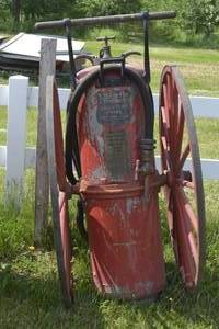 lot 4 image: vintage 5 tall fire extinguisher with hose and nozzle