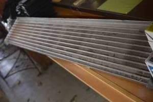 lot 104 image: Metal Shelf, 5 ft by 9.5 in deep