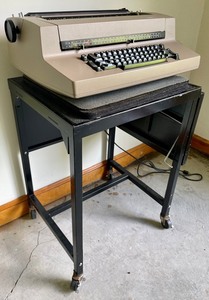 Vintage Sperry Remington Typewriter on a Vintage Extending Metal Table on Casters