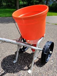 Orange Fertilizer   Grass Seed Spreader
