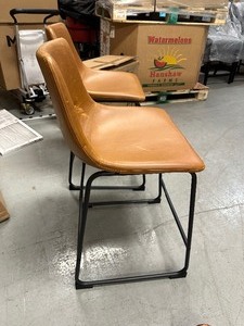 lot 98 image: New Walker Edison Furniture Company Wasatch 24 in. Whiskey Brown Low Back Metal Frame Counter Height Bar Stool with Faux Leather Seat (Set of 2)