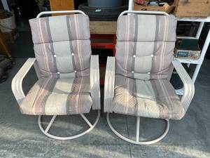 lot 93 image: Cushioned Swivel Patio Chairs