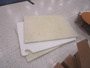 lot 315 image: Pizza Trays, Cutting Boards, 4 Boxes of Napkin Wraps