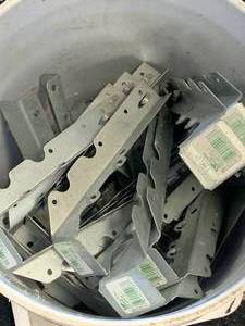lot 21 image: BUCKET FULL (27 POUNDS) 2 INCH X 10 INCH JOIST HINGES