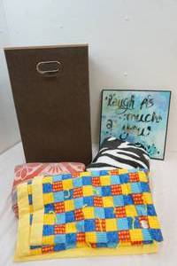 clothing hamper, mirror art and blankets