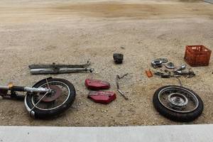 lot 308A image: 1972 Suzuki GT250 Motorcycle Parts - RARE - Front and Rear Wheel Assemblies, Handlebars, Motor Covers, Exhaust, Shocks, Gears, Misc. Parts