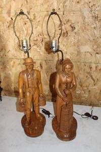 lot 408 image: Lot of (2) Amish Made MCM Carved Wood Pioneer ManWoman Table Lamps
