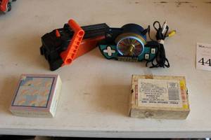 lot 440 image: (2) Puzzles, (1) Wheel Of Fortune Controller, (1) Hot Wheels Track Section