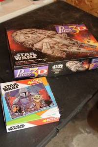 lot 442 image: Lot of (2) Puzzles - Puzz 3D Star Wars Millenium Falcon 857-piece, Disney Buffalo Star Wars 100-piece