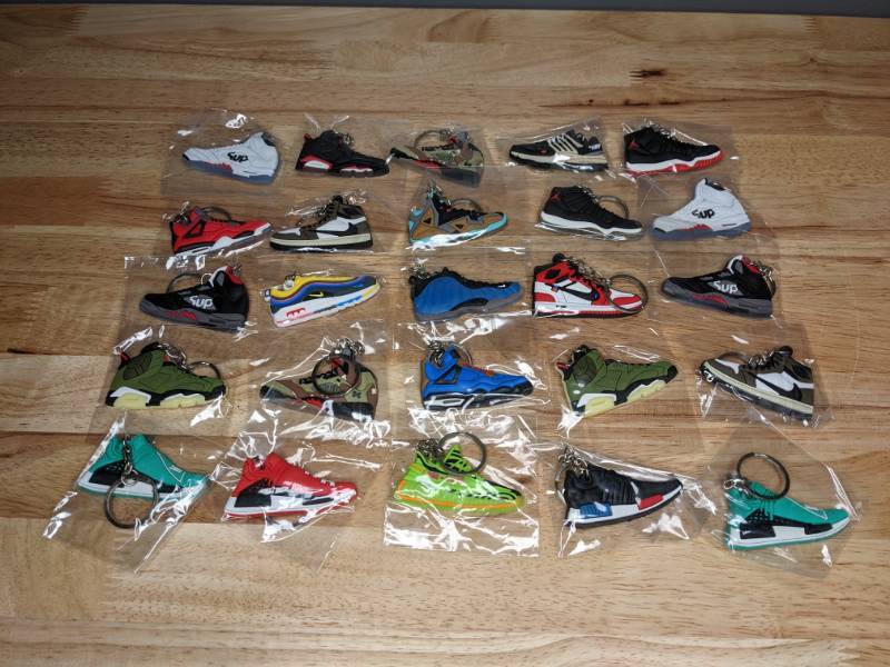 lot 38 image: Collection of 25 Brand New Nike and Jordan and Adidas Shoe Sneaker Keychains Retro Air Max Yeezy Foamposite T